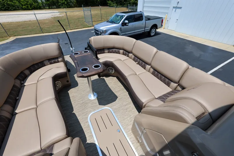 Slide: The Image of Luxurious seating on 2023 Bennington Q 25 QFBA pontoon boat, parked near a truck. - 14
