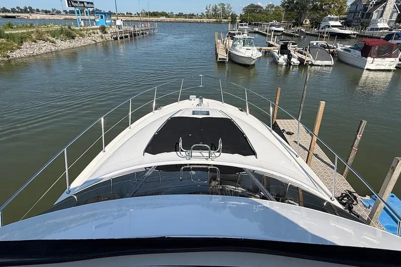 Slide: The Image of 2002 Sea Ray 560 Sedan Bridge yacht docked at marina, aerial view. - 25