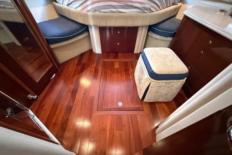 Slide: The Image of Luxurious 2002 Sea Ray 560 Sedan Bridge cabin with polished wood flooring and elegant furnishings. - 95