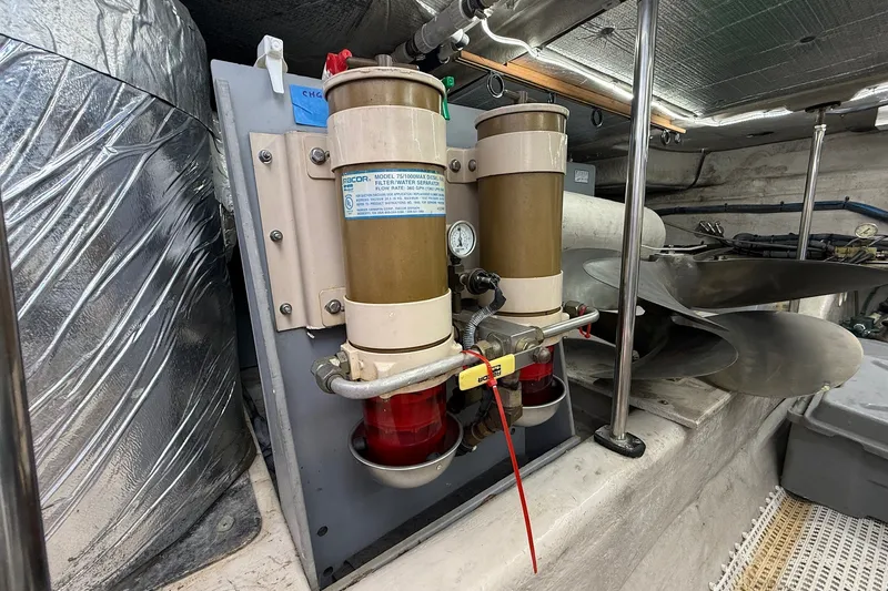Slide: The Image of Engine room of 2002 Sea Ray 560 Sedan Bridge with fuel filtration system. - 130