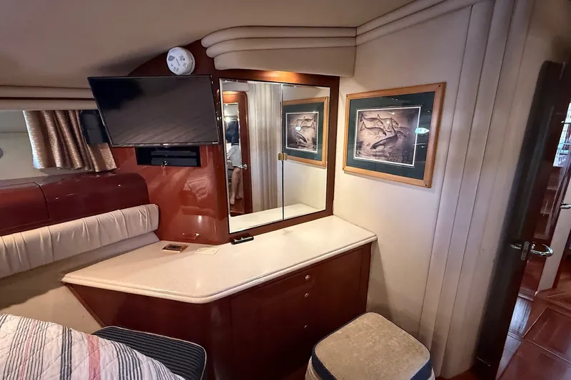 Slide: The Image of Luxurious 2002 Sea Ray 560 Sedan Bridge cabin with TV, mirror, and artwork. - 106