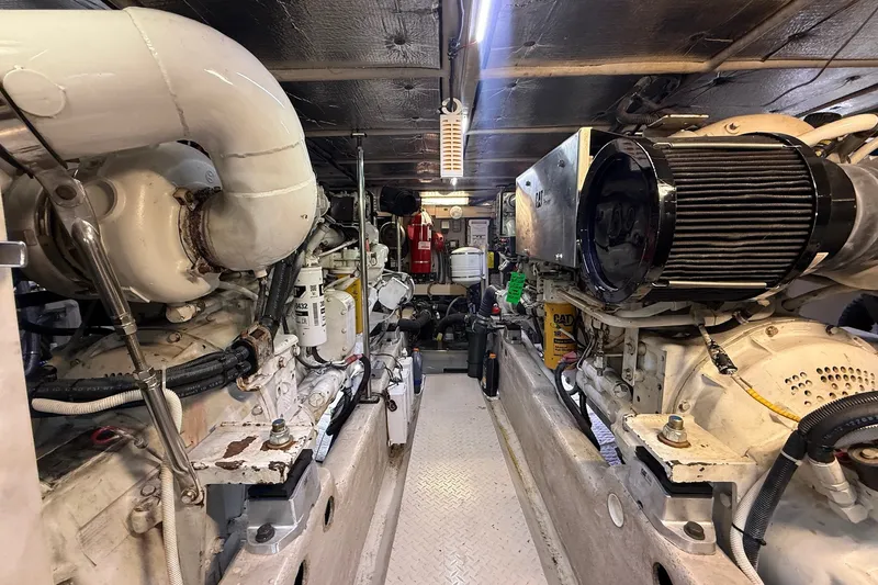 Slide: The Image of Engine room of a 2002 Sea Ray 560 Sedan Bridge yacht, showcasing dual engines. - 108