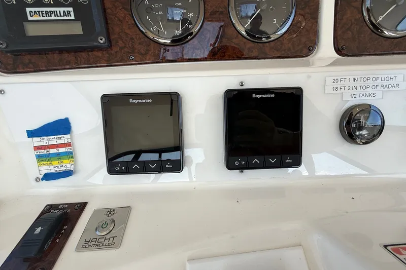 Slide: The Image of Control panel of a 2002 Sea Ray 560 Sedan Bridge with Raymarine displays and gauges. - 39