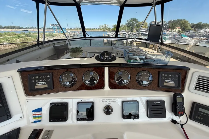 Slide: The Image of Cockpit view of 2002 Sea Ray 560 Sedan Bridge with navigation instruments and controls. - 41