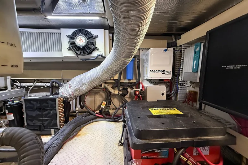 Slide: The Image of Engine room of 2002 Sea Ray 560 Sedan Bridge with ventilation and electrical systems. - 120