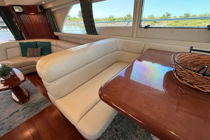 Slide: The Image of Luxurious interior of 2002 Sea Ray 560 Sedan Bridge yacht with plush seating and elegant decor. - 59