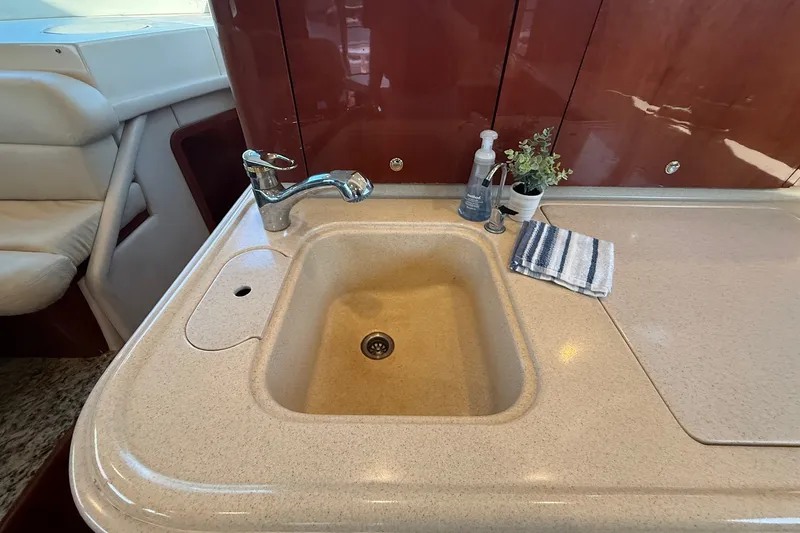 Slide: The Image of Luxurious kitchen sink area on a 2002 Sea Ray 560 Sedan Bridge yacht. - 66