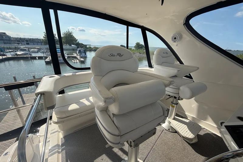 Slide: The Image of Luxurious interior of 2002 Sea Ray 560 Sedan Bridge yacht with plush seating. - 34