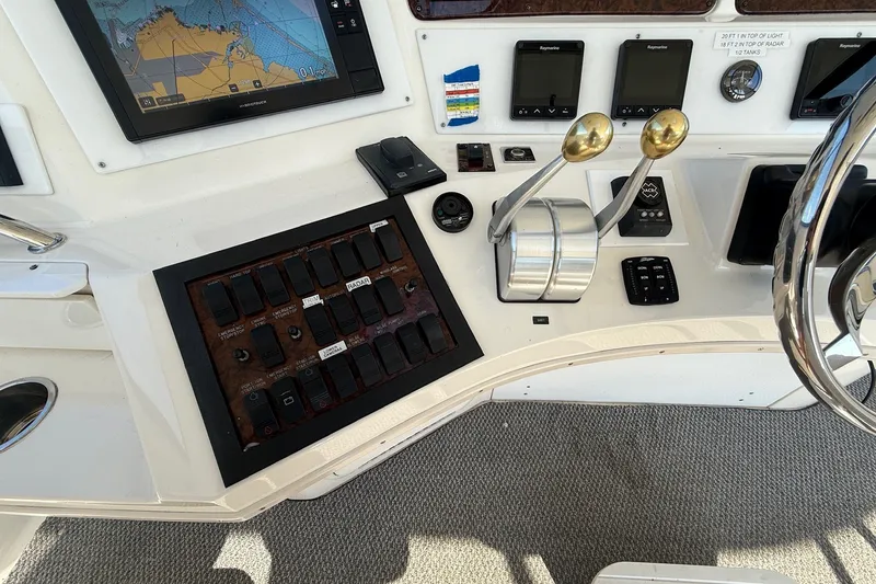 Slide: The Image of Control panel of a 2002 Sea Ray 560 Sedan Bridge yacht with navigation equipment. - 42