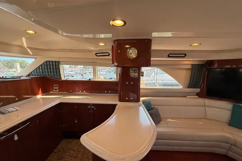 Slide: The Image of Luxurious interior of 2002 Sea Ray 560 Sedan Bridge yacht with elegant seating and cabinetry. - 61