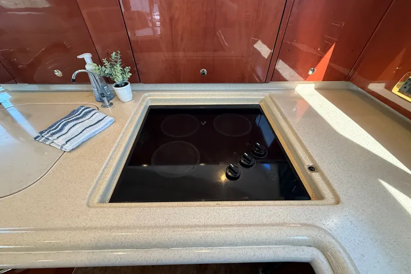 Slide: The Image of Luxury yacht kitchen with stovetop, Sea Ray 560 Sedan Bridge, 2002 model. - 67