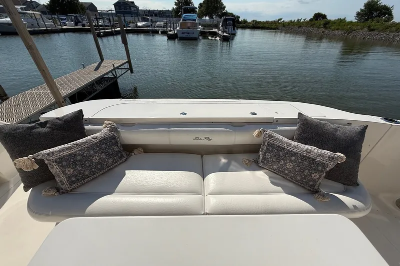 Slide: The Image of Luxury seating area on 2002 Sea Ray 560 Sedan Bridge yacht, docked at marina. - 12