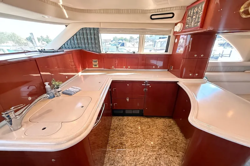 Slide: The Image of Luxurious kitchen interior of 2002 Sea Ray 560 Sedan Bridge yacht. - 62