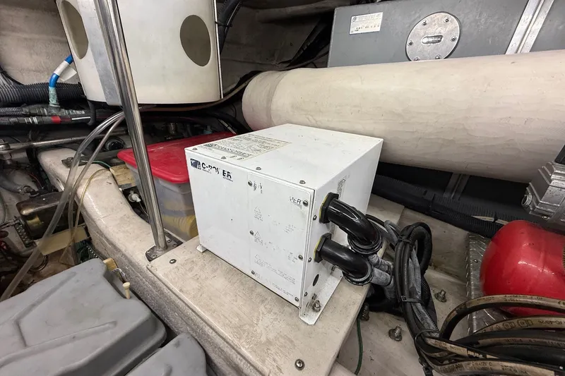 Slide: The Image of Engine room of 2002 Sea Ray 560 Sedan Bridge with electrical components and wiring. - 135