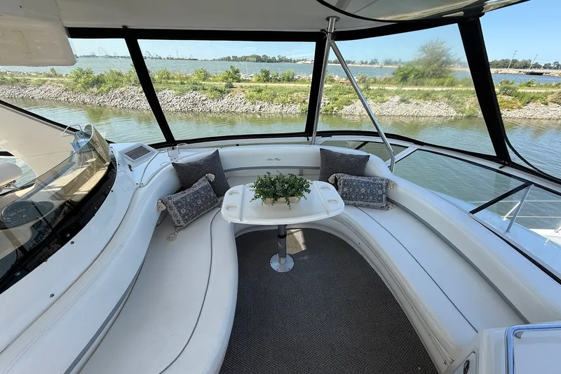 Slide: The Image of Luxurious 2002 Sea Ray 560 Sedan Bridge yacht interior with scenic water view. - 30