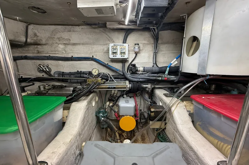 Slide: The Image of Engine room of a 2002 Sea Ray 560 Sedan Bridge with visible wiring and components. - 132