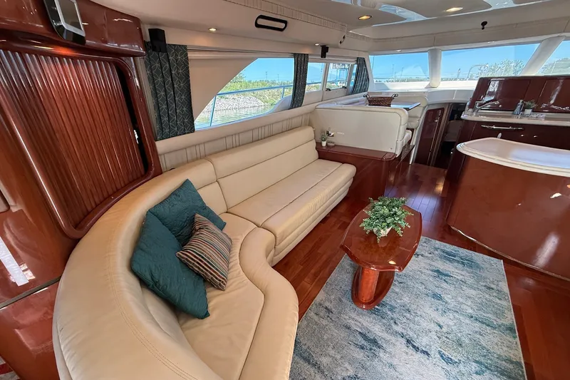 Slide: The Image of Luxurious interior of 2002 Sea Ray 560 Sedan Bridge yacht with elegant seating and decor. - 52