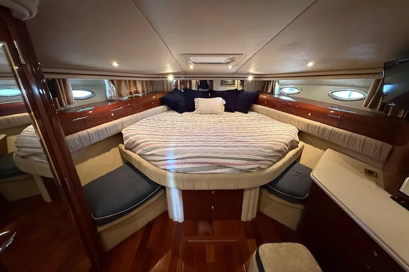 Slide: The Image of Luxurious bedroom interior of 2002 Sea Ray 560 Sedan Bridge yacht. - 105
