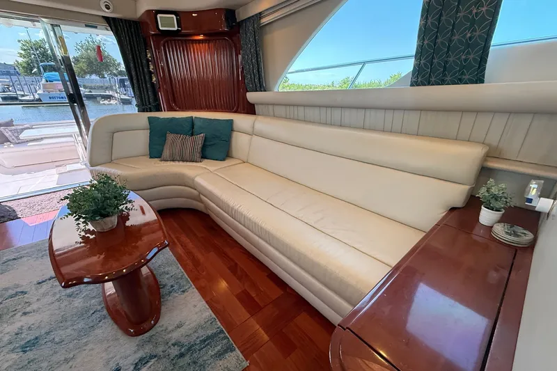 Slide: The Image of Luxurious interior of 2002 Sea Ray 560 Sedan Bridge yacht with elegant seating and decor. - 55