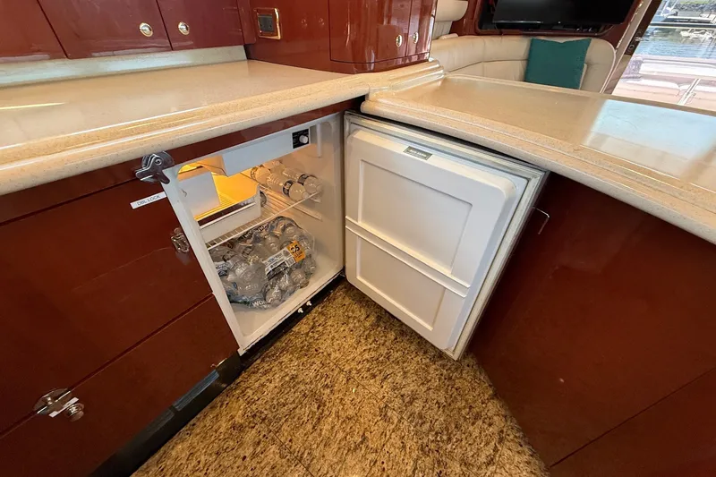 Slide: The Image of Luxury yacht kitchen with open fridge, Sea Ray 560 Sedan Bridge, 2002 model. - 70
