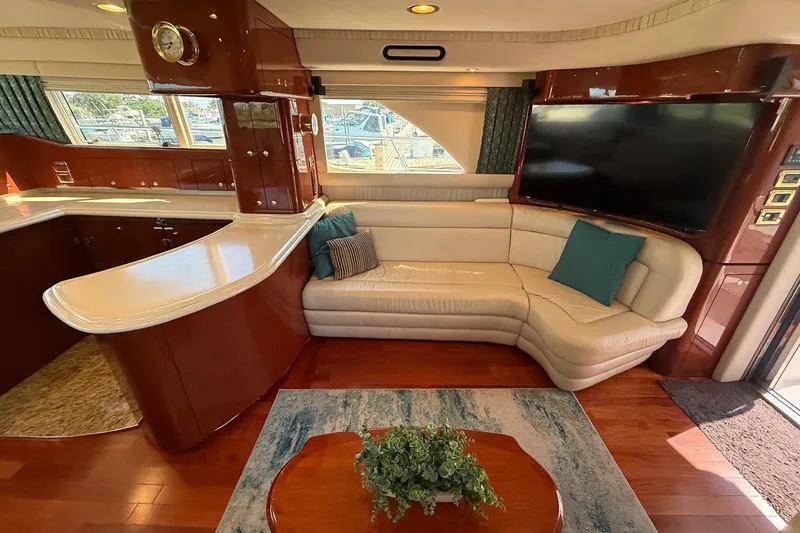 Slide: The Image of Luxurious interior of a 2002 Sea Ray 560 Sedan Bridge yacht with elegant seating and modern decor. - 53