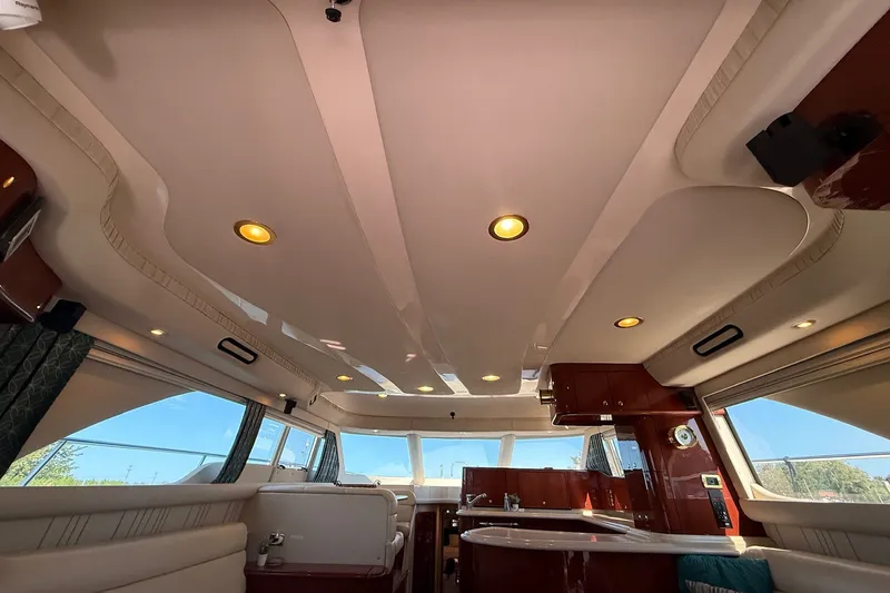 Slide: The Image of Interior of 2002 Sea Ray 560 Sedan Bridge yacht with elegant lighting and wood finishes. - 75