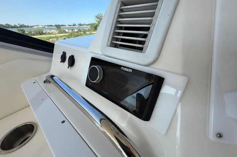 Slide: The Image of Control panel of a 2002 Sea Ray 560 Sedan Bridge yacht with Fusion audio system. - 37