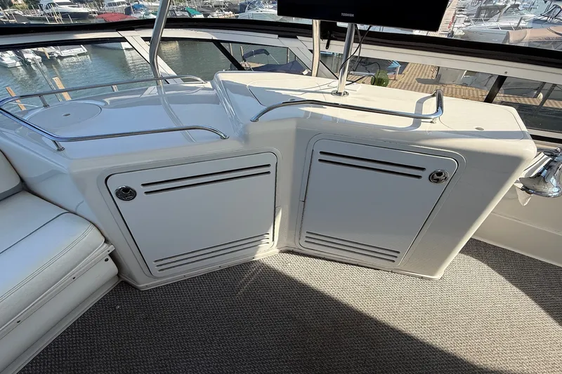 Slide: The Image of Interior view of 2002 Sea Ray 560 Sedan Bridge yacht with storage compartments. - 28