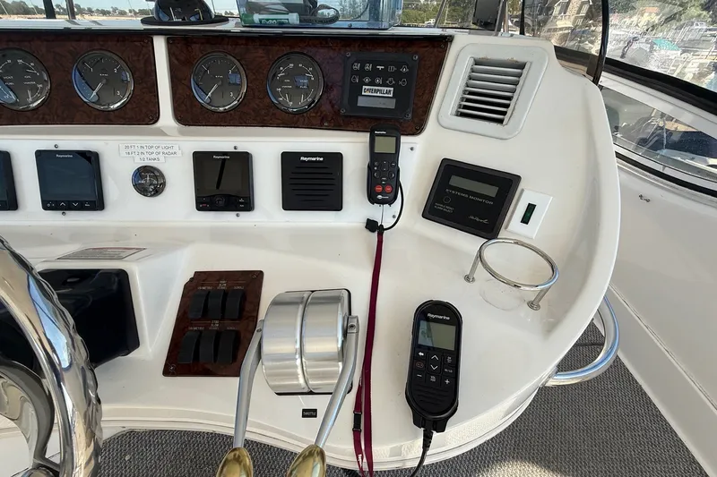 Slide: The Image of Control panel of a 2002 Sea Ray 560 Sedan Bridge yacht with navigation instruments. - 43