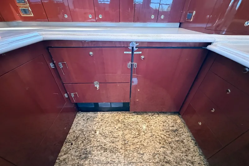 Slide: The Image of Luxurious kitchen cabinetry on a 2002 Sea Ray 560 Sedan Bridge yacht. - 65
