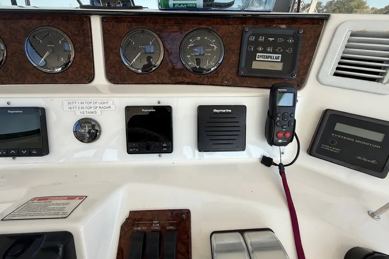 Slide: The Image of Control panel of a 2002 Sea Ray 560 Sedan Bridge yacht with navigation instruments. - 40