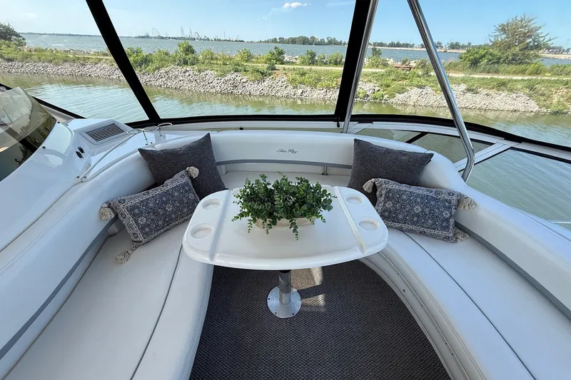 Slide: The Image of Luxurious 2002 Sea Ray 560 Sedan Bridge interior with elegant seating and scenic water view. - 23