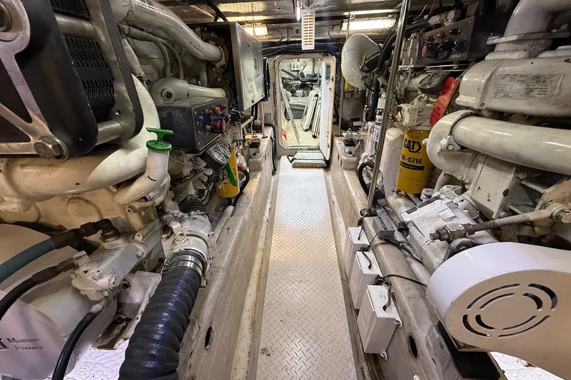 Slide: The Image of Engine room of a 2002 Sea Ray 560 Sedan Bridge yacht, showcasing machinery and components. - 122