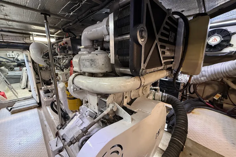 Slide: The Image of Engine room of a 2002 Sea Ray 560 Sedan Bridge yacht, showcasing marine machinery. - 124