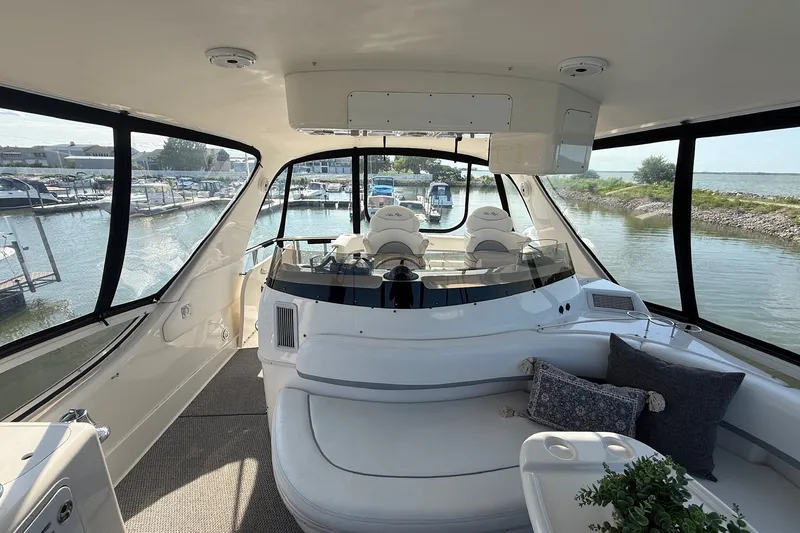 Slide: The Image of Luxurious 2002 Sea Ray 560 Sedan Bridge interior with panoramic marina view. - 45