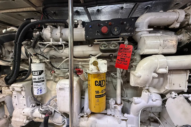 Slide: The Image of Engine room of a 2002 Sea Ray 560 Sedan Bridge with Caterpillar components. - 127