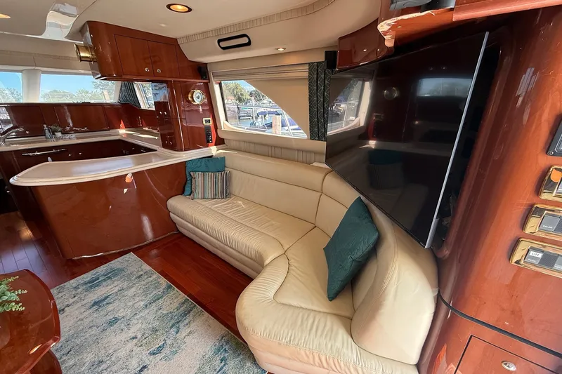 Slide: The Image of Luxurious interior of a 2002 Sea Ray 560 Sedan Bridge yacht with leather seating and modern amenities. - 51