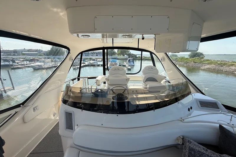 Slide: The Image of Interior view of 2002 Sea Ray 560 Sedan Bridge yacht at marina. - 32