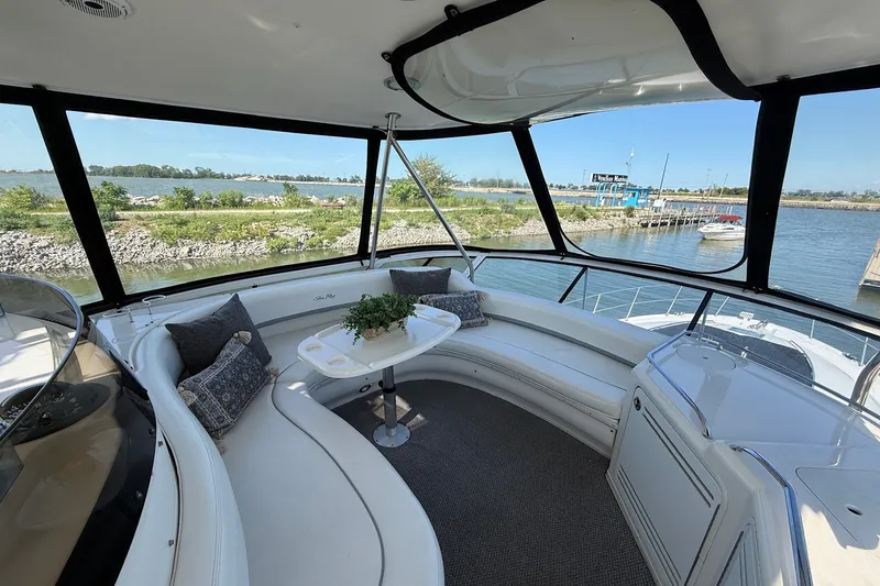 Slide: The Image of Luxurious 2002 Sea Ray 560 Sedan Bridge yacht interior with scenic waterfront view. - 22
