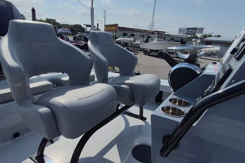 Slide: The Image of Interior of 2027 Blazer 675 Ultimate Bay boat with modern seating and controls. - 17