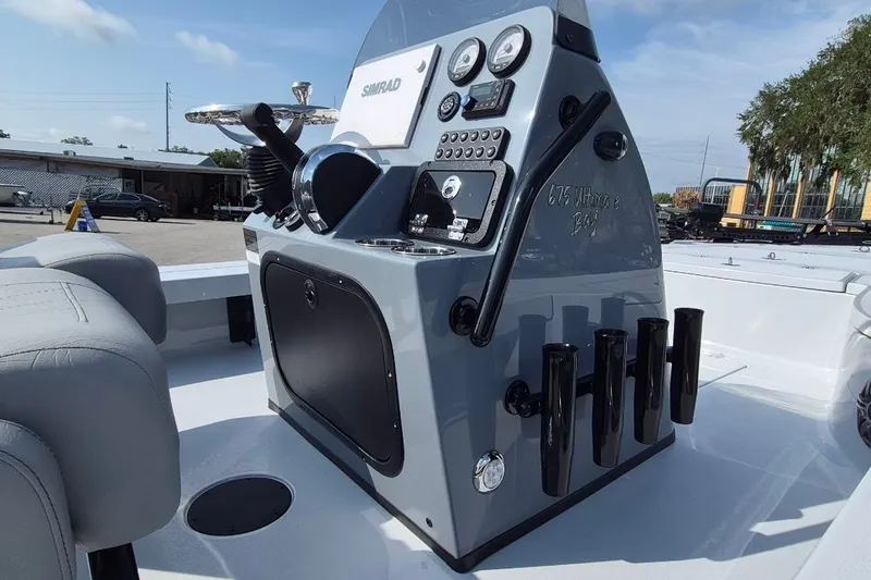 Slide: The Image of Control panel of 2027 Blazer 675 Ultimate Bay boat with gauges and rod holders. - 20
