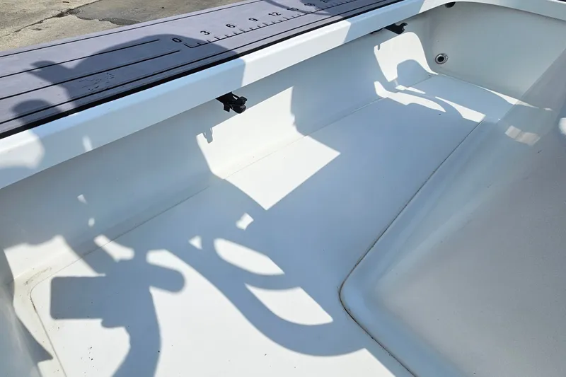 Slide: The Image of Interior of a 2012 East Cape Fury boat with a measuring ruler on the side. - 26