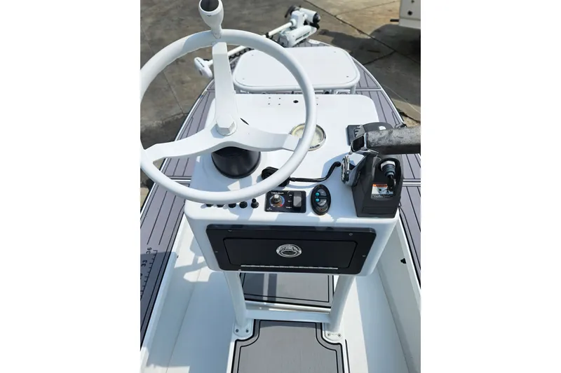 Slide: The Image of 2012 East Cape Fury boat console with steering wheel and controls. - 19