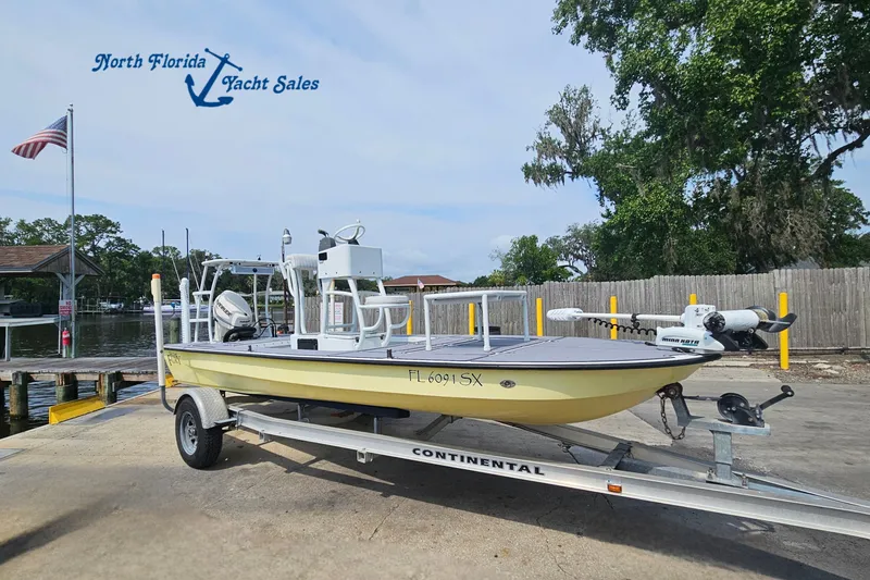 The Image of 2012 East Cape Fury boat on trailer at North Florida Yacht Sales dock. - 1