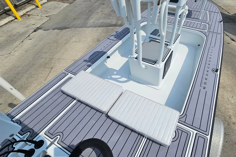 Slide: The Image of 2012 East Cape Fury boat deck with padded seating and sleek design. - 24