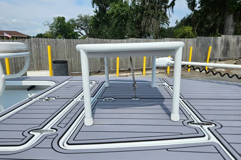 Slide: The Image of 2012 East Cape Fury boat deck with custom non-slip flooring and white railing. - 14
