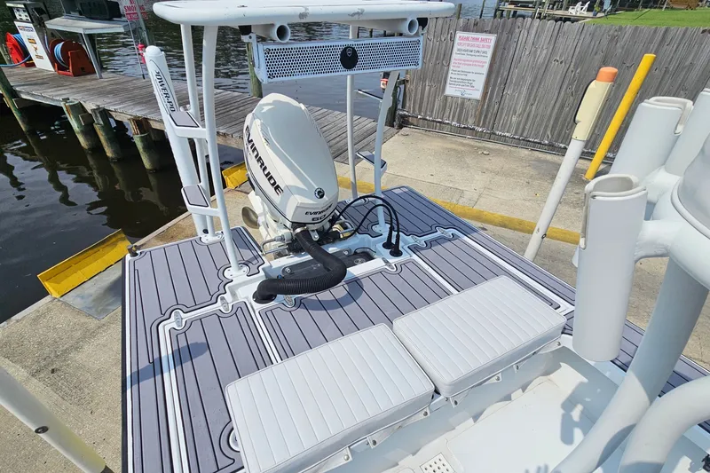 Slide: The Image of 2012 East Cape Fury boat with Evinrude engine at a dockside location. - 23