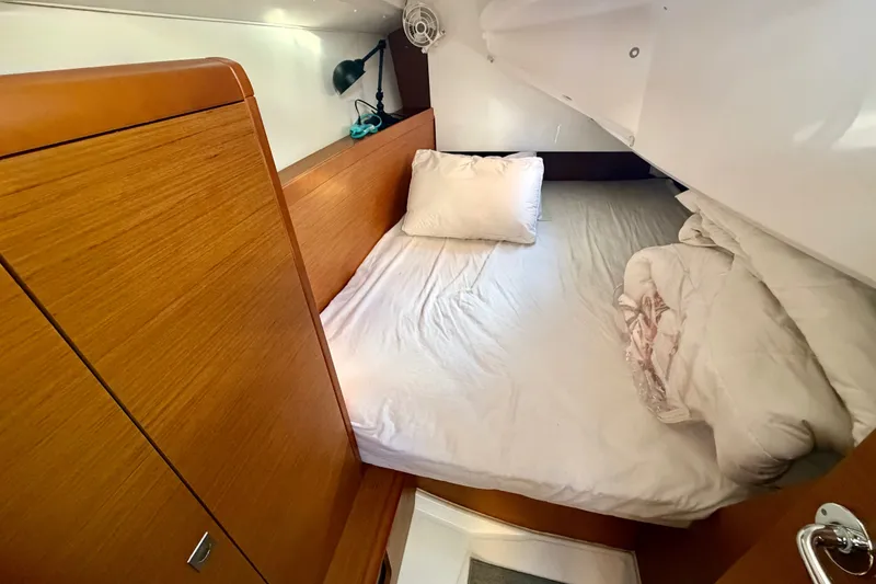 Slide: The Image of Cozy cabin interior of 2019 Jeanneau Sun Odyssey 349 sailboat with wooden finishes. - 32