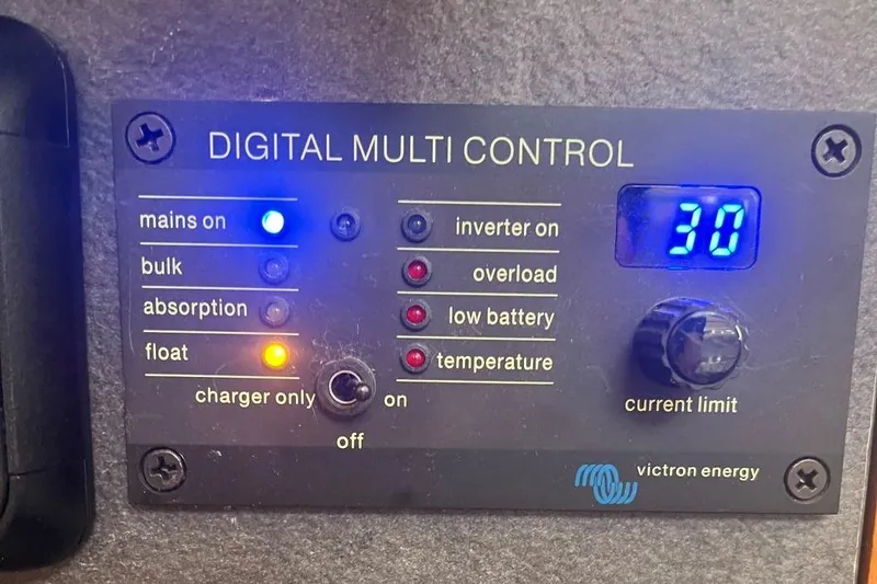 Slide: The Image of Digital multi-control panel with various indicators and a knob for current limit adjustment. - 24