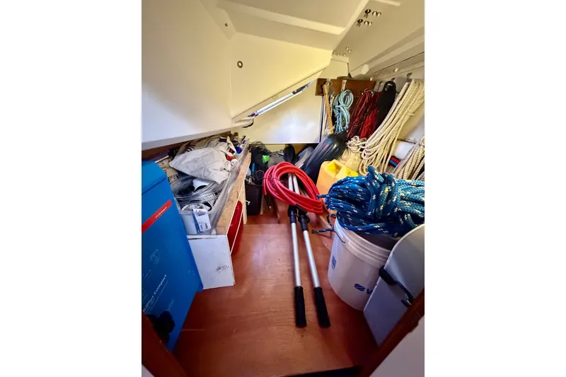Slide: The Image of Storage area on a 2019 Jeanneau Sun Odyssey 349 sailboat with ropes and equipment. - 37